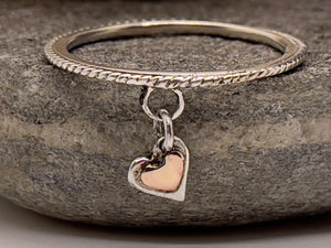 Floating heart ring